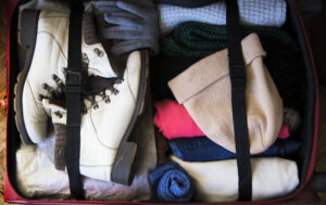 winter-clothing-packed-in-suitcase