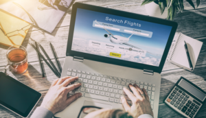 searching for flights on a laptop