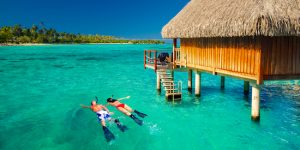 Alt tag not provided for image https://www.airfarewatchdog.com/blog/wp-content/uploads/sites/26/2019/01/Tahiti-Bungalow-Couple-Snorkel-Shutter-300x150.jpg