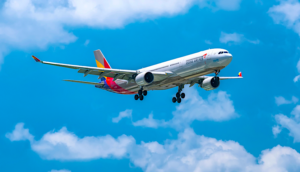 Asiana Airlines A330 in flight with blue skies