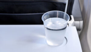 Alt tag not provided for image https://www.airfarewatchdog.com/blog/wp-content/uploads/sites/26/2019/11/airplane-water-on-a-tray-table-300x172.jpg