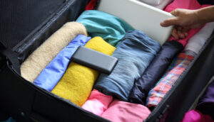 Rolling clothes for packing a suitcase