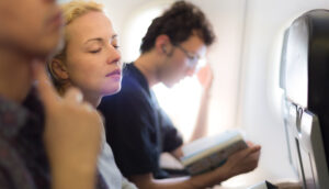 three-people-sitting-in-plane