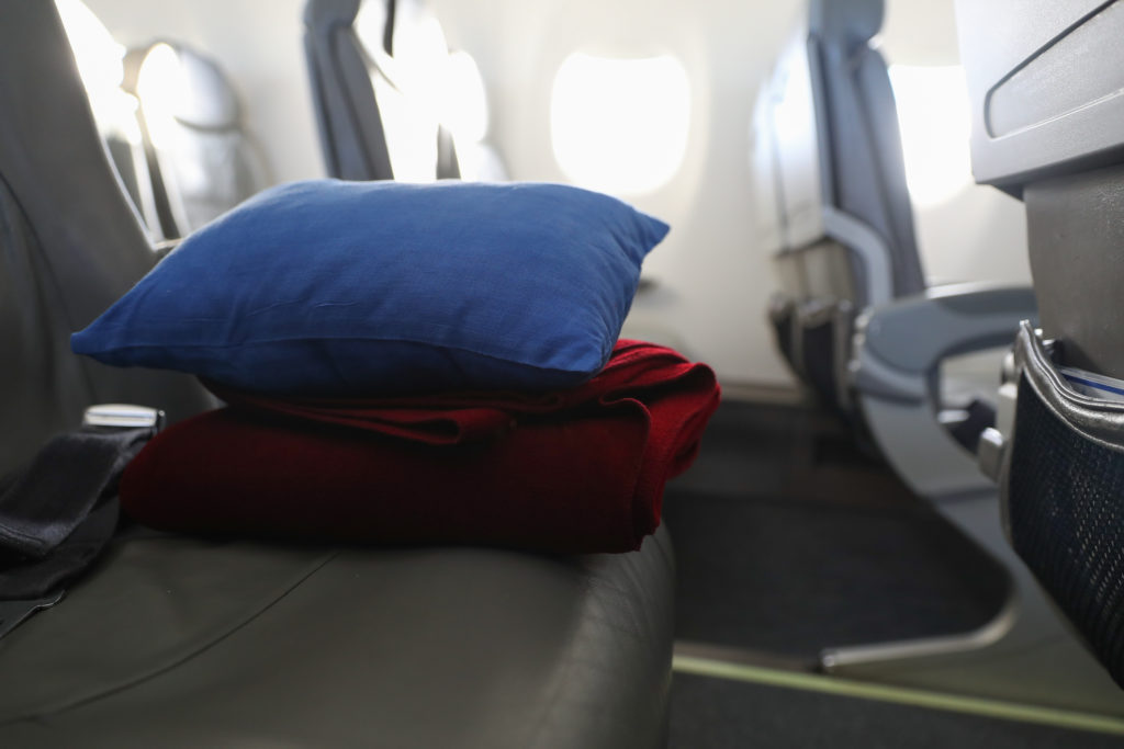 Blanket and pillow on plane seat