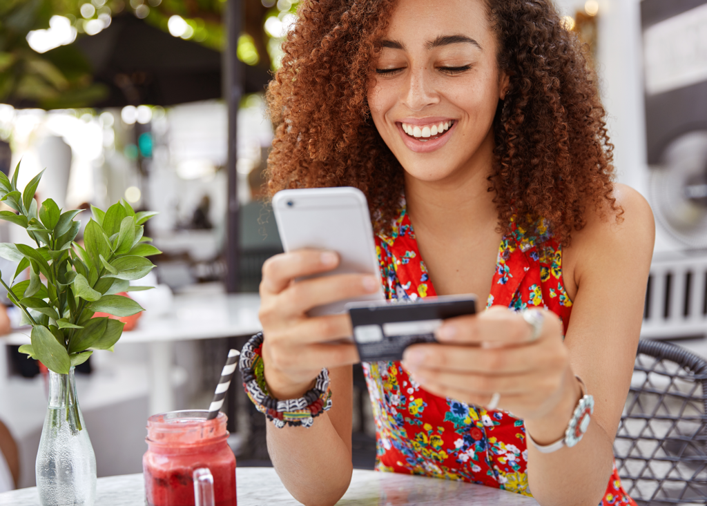 Woman making a credit card purchase on her phone