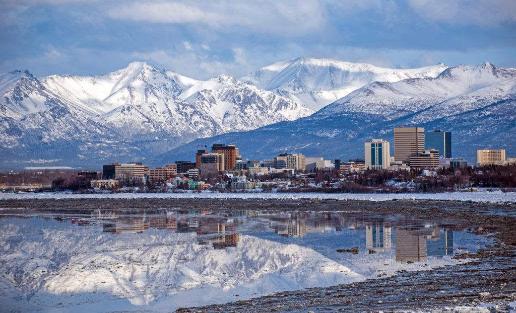 Anchorage, Alaska skyline on the backdrop of snowy mountains