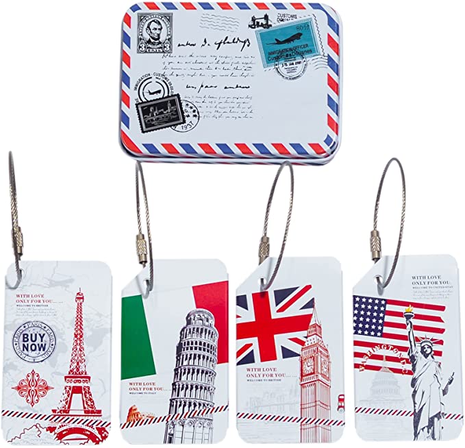 Four luggage tags and a metal container with imagery from Italy, France, England, and the United States