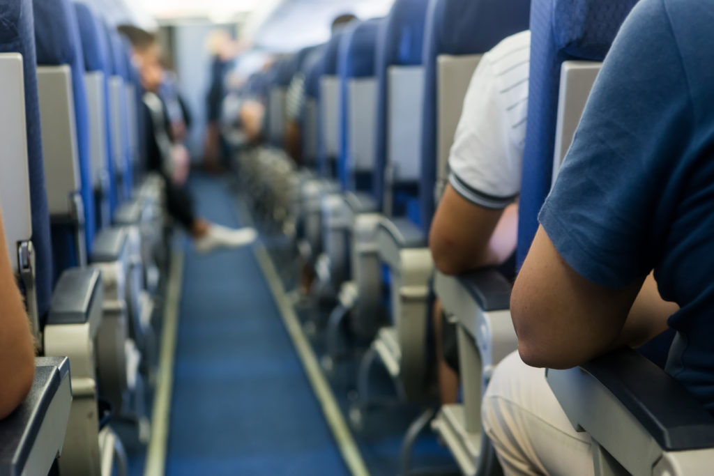 The central aisle of an airplane