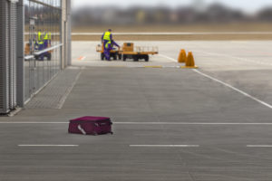Suitcase abandoned on the tarmac of an airport