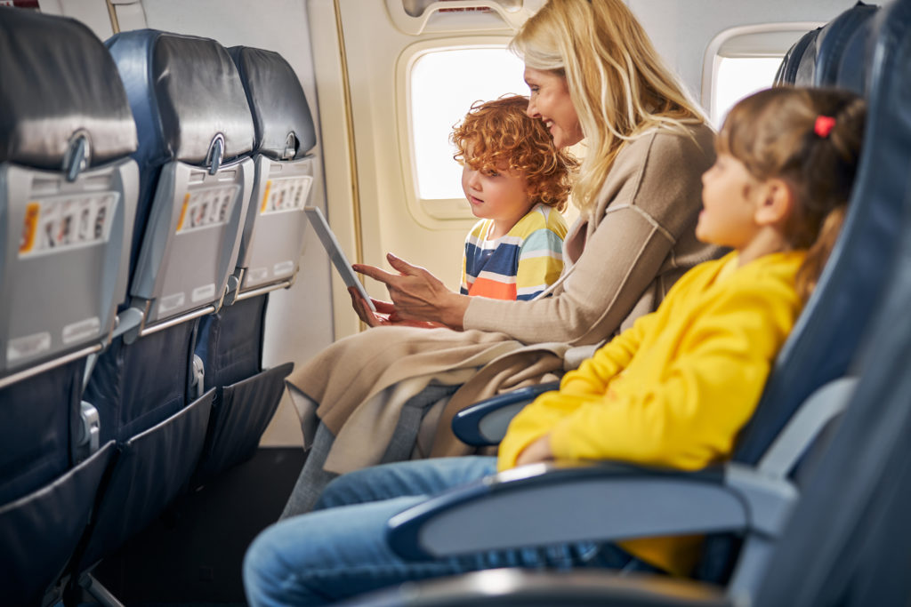 Family sitting together on airplane