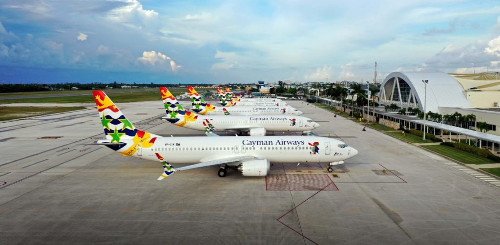 Row of Cayman Airways planes on tarmac